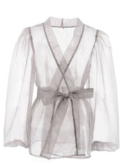 Chemisier sexy transparent à col en V et manches longues bouffantes avec nœud papillon