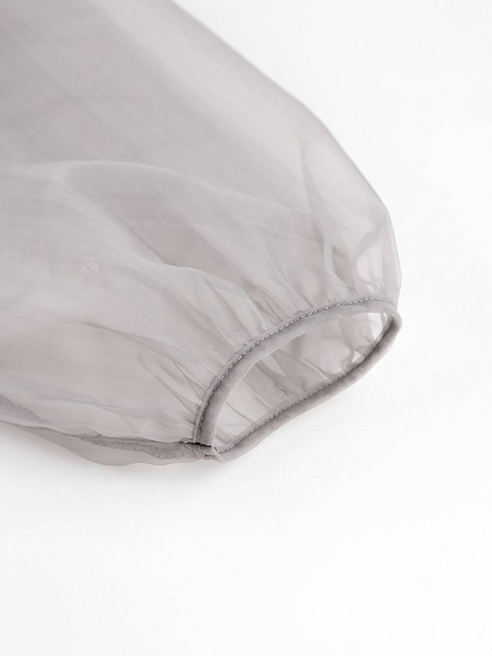 Chemisier sexy transparent à col en V et manches longues bouffantes avec nœud papillon
