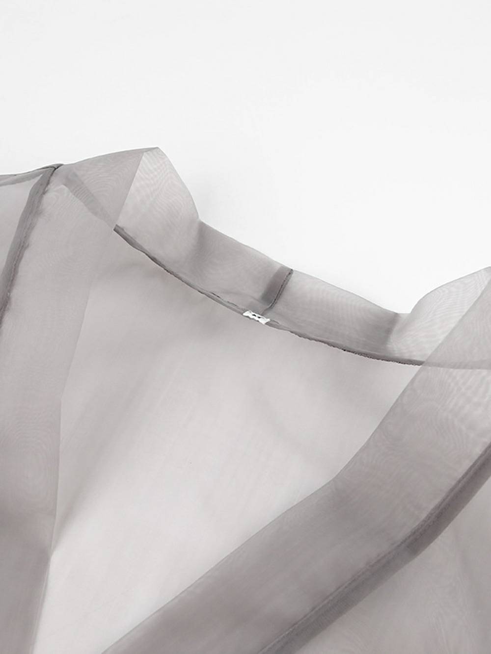 Chemisier sexy transparent à col en V et manches longues bouffantes avec nœud papillon