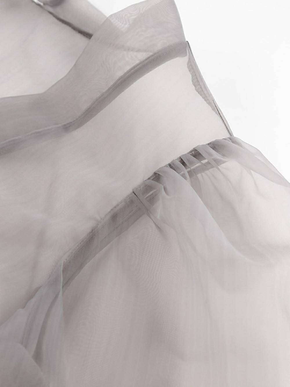 Chemisier sexy transparent à col en V et manches longues bouffantes avec nœud papillon